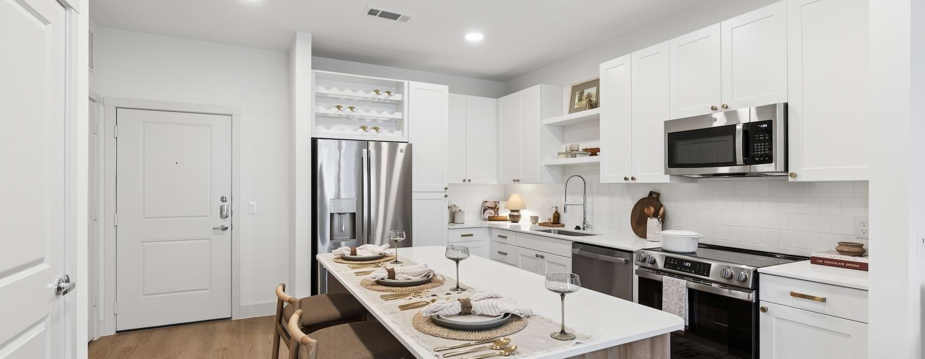 a kitchen with white cabinets