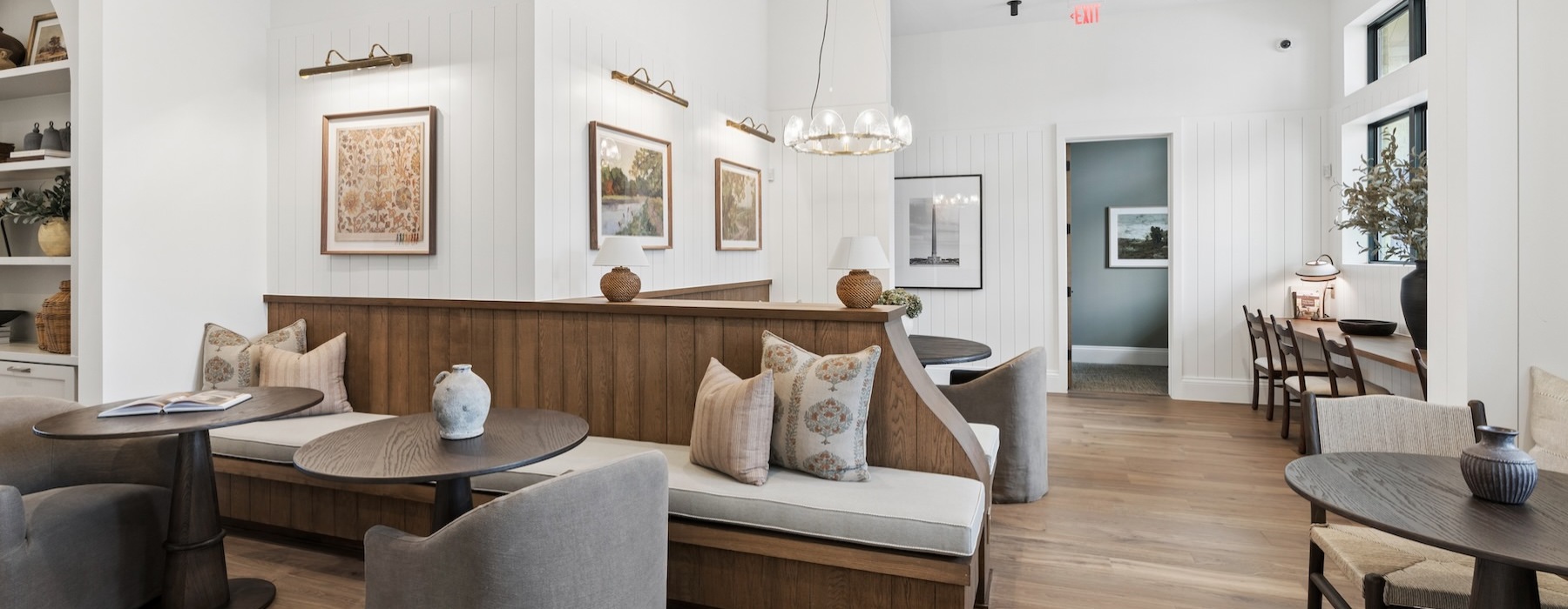 a clubroom with tables and chairs