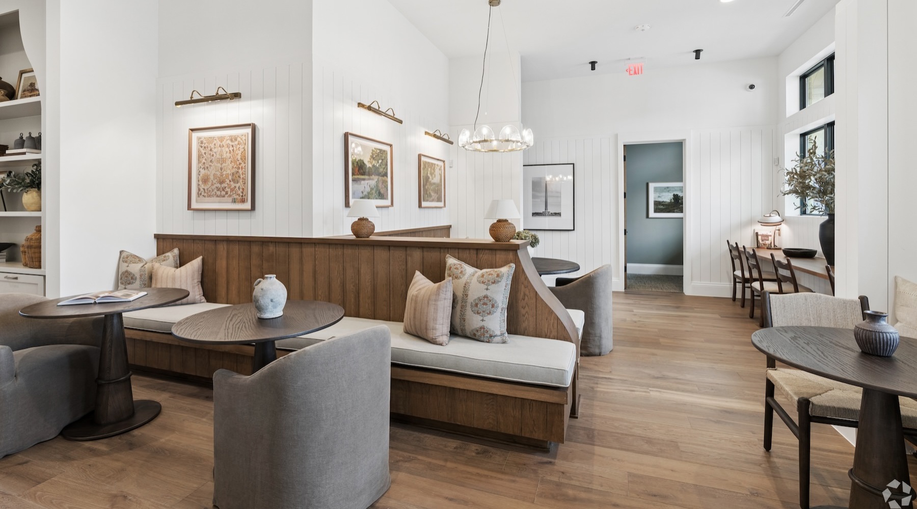 a clubroom with tables and chairs