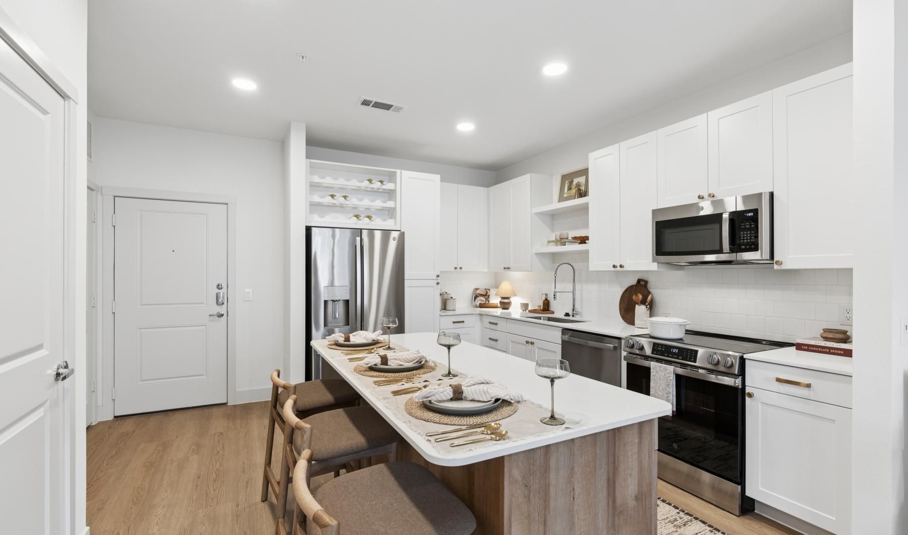 a kitchen with white cabinets