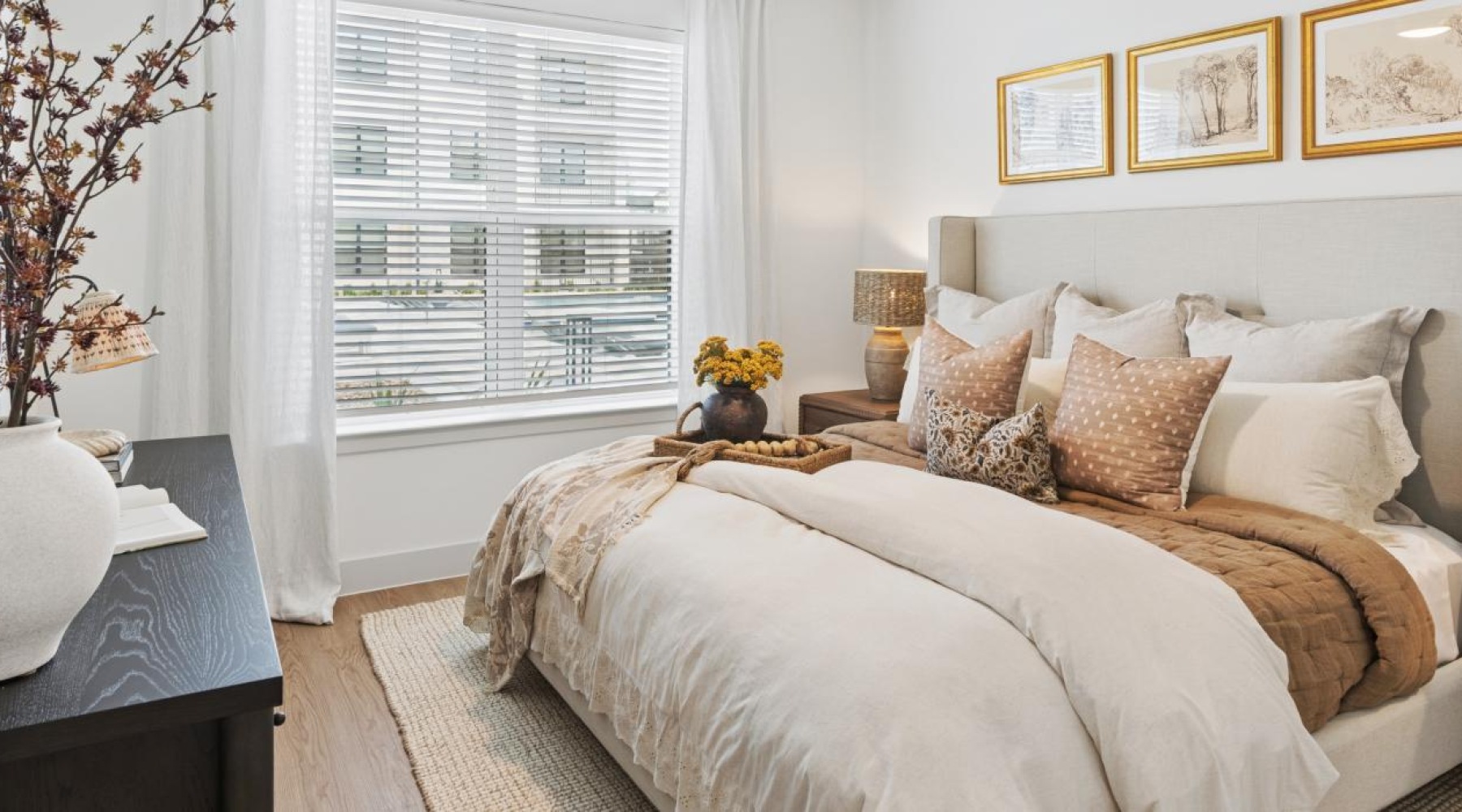 a bedroom with a bed and a dresser